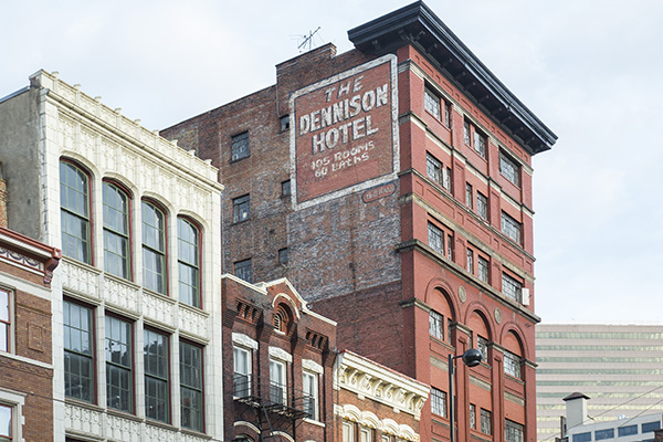 The Enquirer editorialized in favor of tearing down the Dennison, owned by one of the paper's largest advertisers