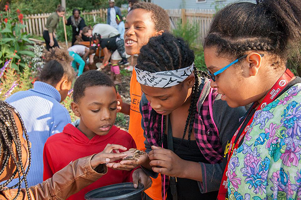 Students participate in garden club at Douglass Elementary.