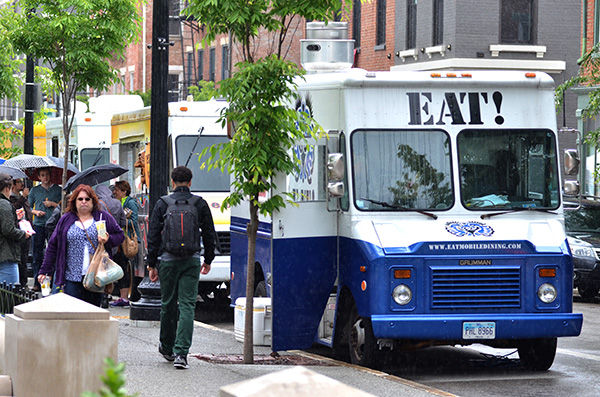 A line of food trucks around Washington Park.