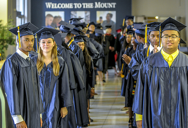 Jabril Bryant (front left) and his classmates comprise DePaul Cristo Rey's first graduating class