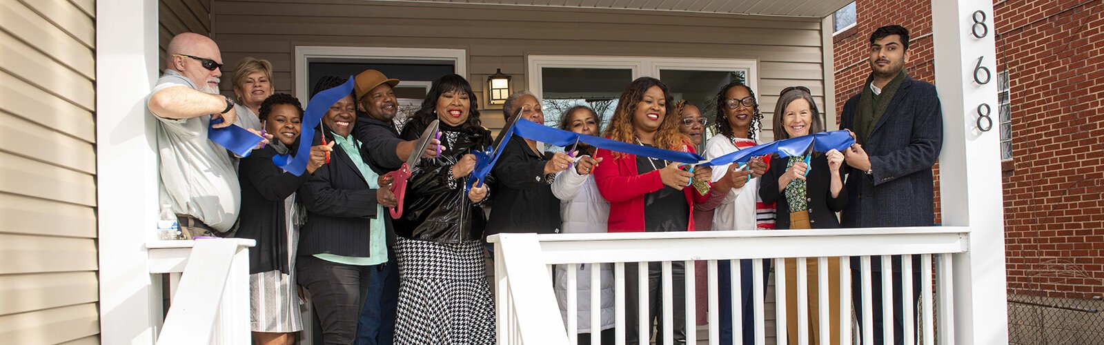 Ribbon-cutting L to R: Ronald Shouse, Laura Brunner, Joyce Powdrill, Ruby Kinsey-Mumphrey, Eric Hunn, Stephanie Summerow Dumas, LaVerne Mitchell, Deborah Robb, Alicia Reece, Tonya Key, Jeannie Stinson, Denise Driehaus, & Muhammad “Saram” Waraich. 