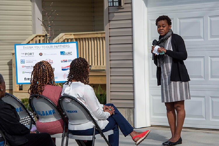 Village Manager of Lincoln Heights Joyce Powdrill speaks at the unveiling of two new residences eagerly anticipated by the community. 