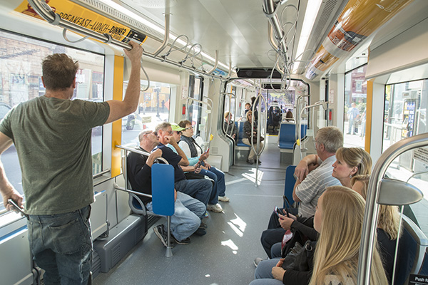 A weekday crowd of riders on the streetcar.