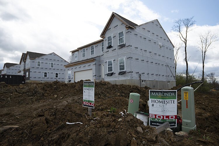 Sixteen new single-family homes are now in various states of construction, or newly finished, in a development along Waycross Road.