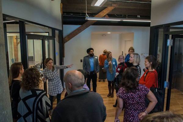 Attendees at the Center for Great Neighborhoods in Covington, one of three tour stops at last year's IDEALAB.