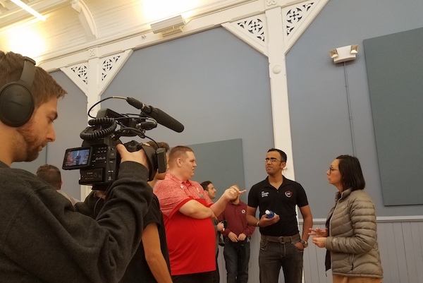 UC professor Jonathan Corey, Hyperloop UC team member Sid Thatham and OKI's Lorrie Platt