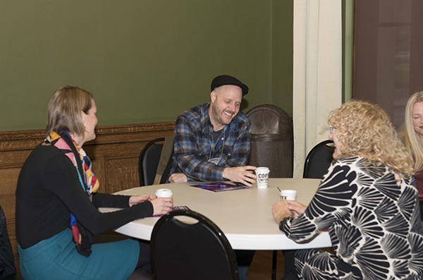 Attendees gathered for pre-event coffee and conversation.