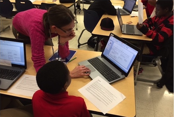 A teacher utilizing the contents of the traveling suitcases in her classroom.