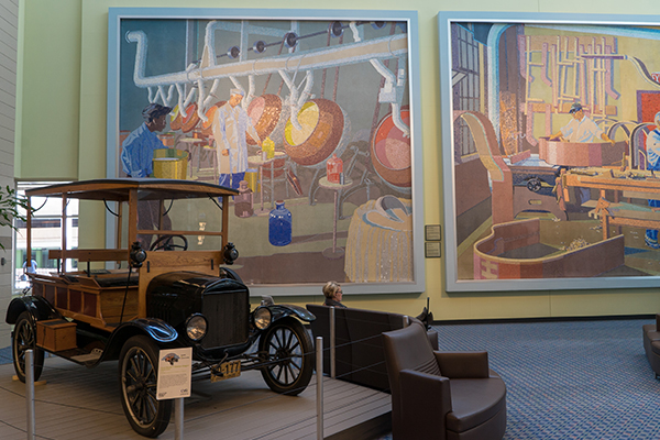 Pictured: Two of 18 mosaic-tile murals that call the airport home.