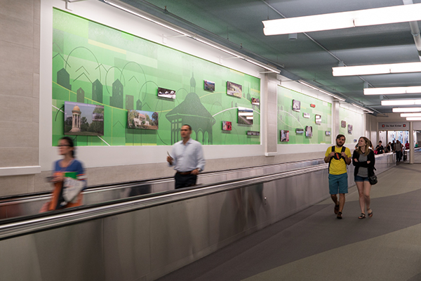 Cincinnati Enquirer photos of local icons line CVG's moving sidewalks.