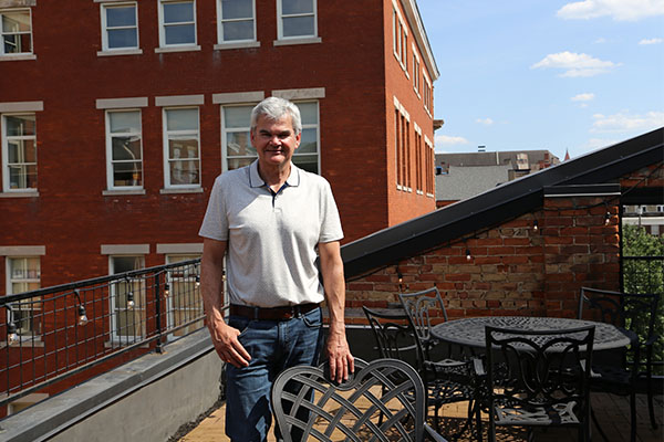 McCafferty, a former suburbanite, now teaches accounting courses at Chatfield College across the street from his new OTR home.