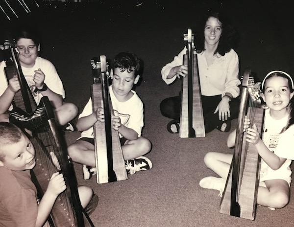 SCPA harp teacher Michelle Gwynne with a group of students.