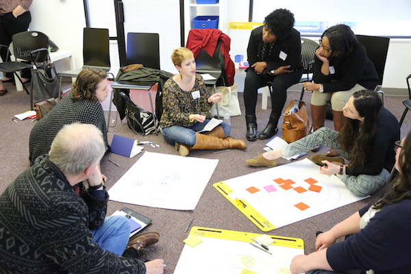 A group of nonprofits discuss their projects during last year's Studio C program.