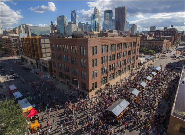 People mill around the Street Pub at a previous event in Milwaukee.