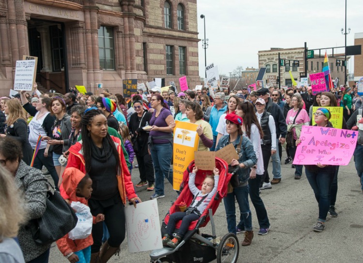 A diverse crowd of men, women, and children attended.