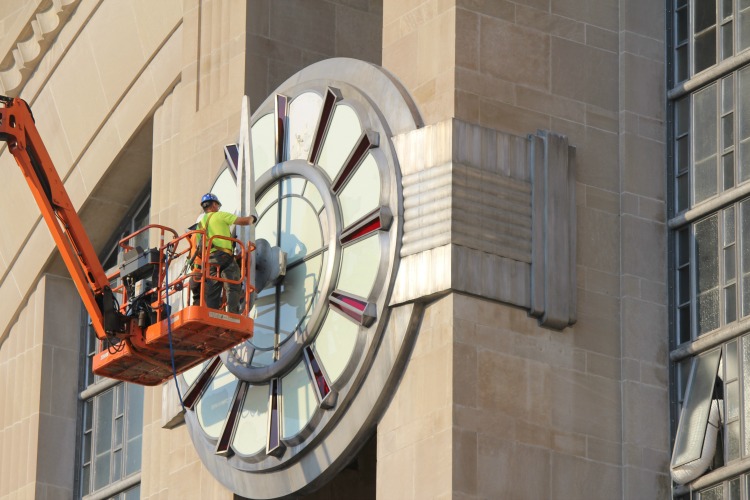 A member of the Verdin staff carefully secures the hands in place.