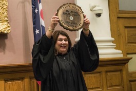 Stark County Common Pleas Judge Taryn Heath displays a plaque presented to her during the Stark county Honor Court.