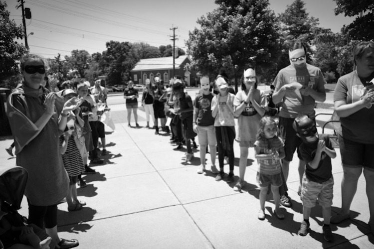 People line up to say goodbye to Chris Collier, who spent ten years as an assistant principal at Cincinnati's public Montessori schools.