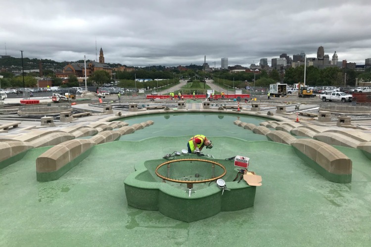 Workers carefully reassembled the center geyser.