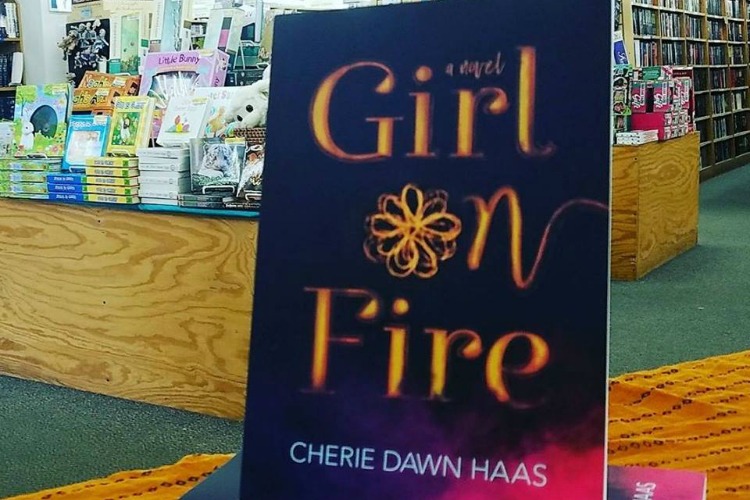 Haas' debut novel, "Girl on Fire."