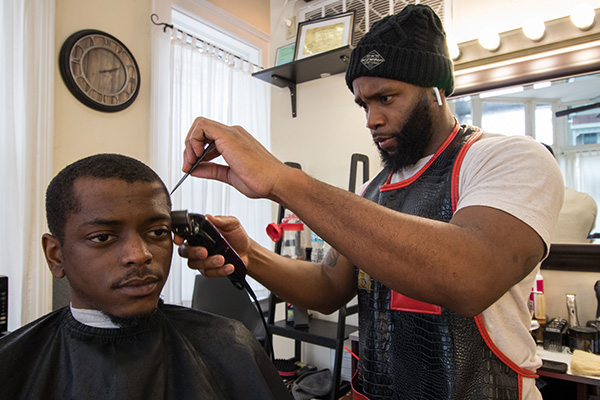 Wale Giwa, owner of Upper Kutz, wants his shop to be a space for advancement, both for barbers and health professionals.