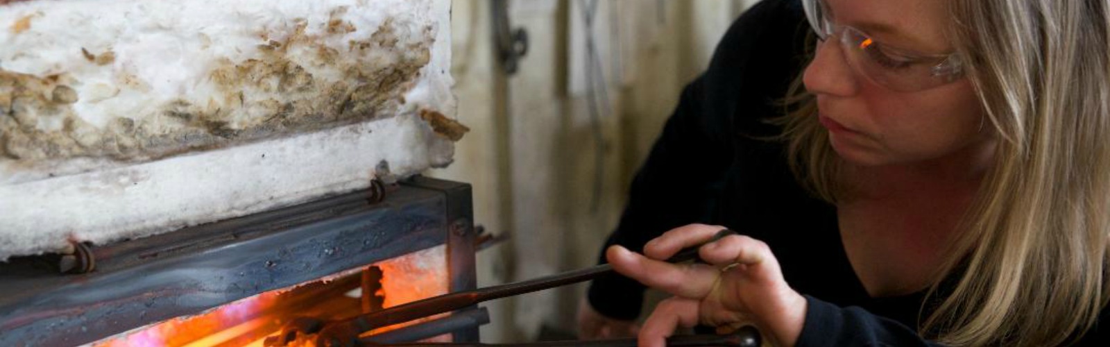 Kate Demske welding at Solid Ground Studio