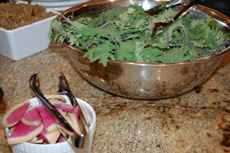 Prep for the grain bowls begins at each station.