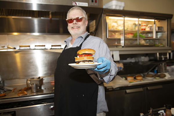 Joe Tucker with "Big Tucker Burger"