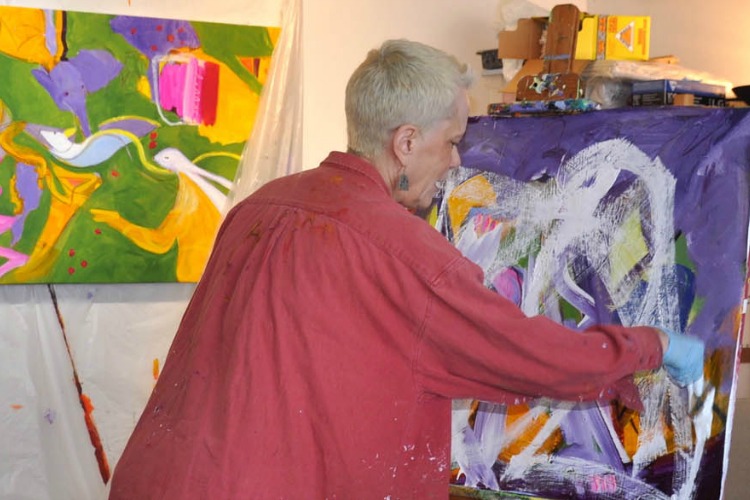 Susan Crew painting in her Essex studio.