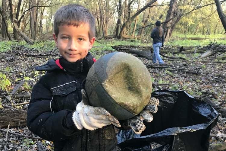 Volunteers clean up a variety of garbage along the Great Miami River.