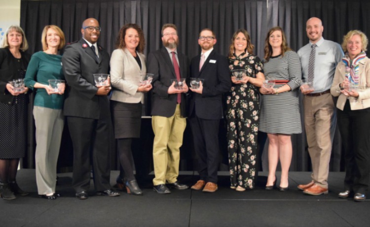 L-R: Karen Etling, Lisa Sweasy, Lt. Malcolm Daniels, Acena Beck, David Hastings, Mitch Haralson, Maria Dunlap, Marie Rusincovitch, Alex Kuhns, and Dawn Rhodes 