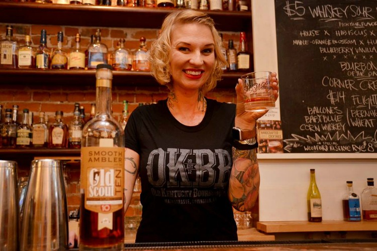 Molly Wellmann pours a cocktail.