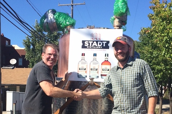Mike and John Funcheon receiving the first of two of Stadt Distillery's commercial stills.