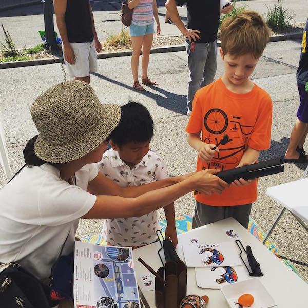 Kids test out different instruments at September's Art Off Pike. Caravan's next event is Ladyfest this weekend.
