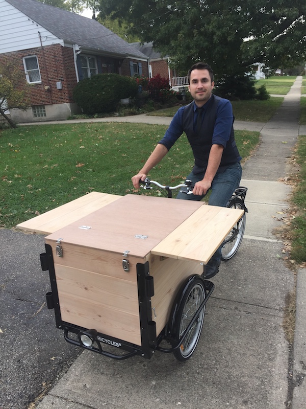 Aaron Greene with the prototype of his mobile science lab, It's Just Science.