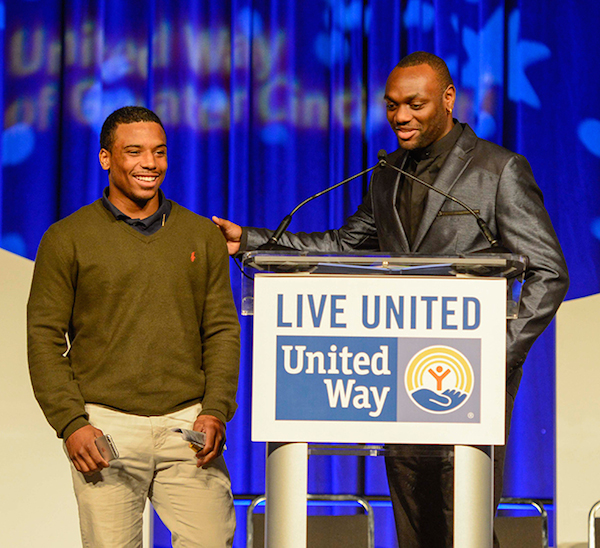 Terence Daniels and Terrell Blue of Big Brothers, Big Sisters of Cincinnati present the corporate heroes award.