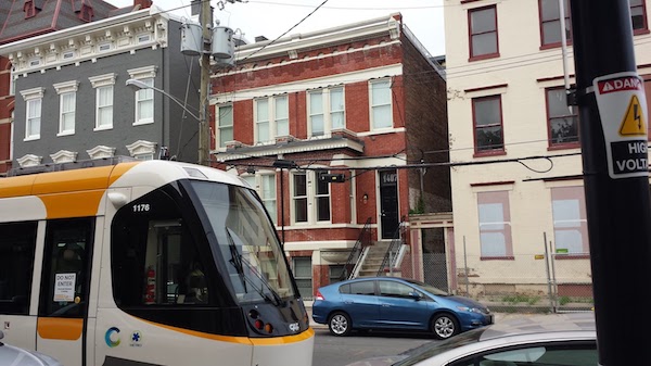 The restoration of this raised-basement duplex received a Sustainability Award.