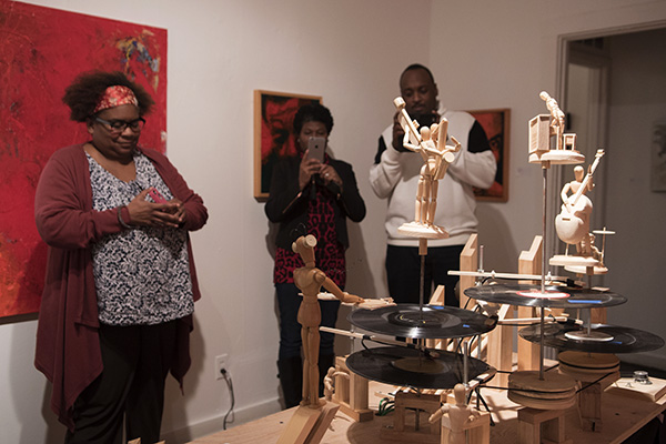 Visitors enjoy art in The Greenwich's third-floor gallery space.