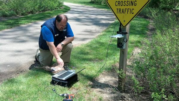 A Great Parks volunteer collecting data for its attendance study.