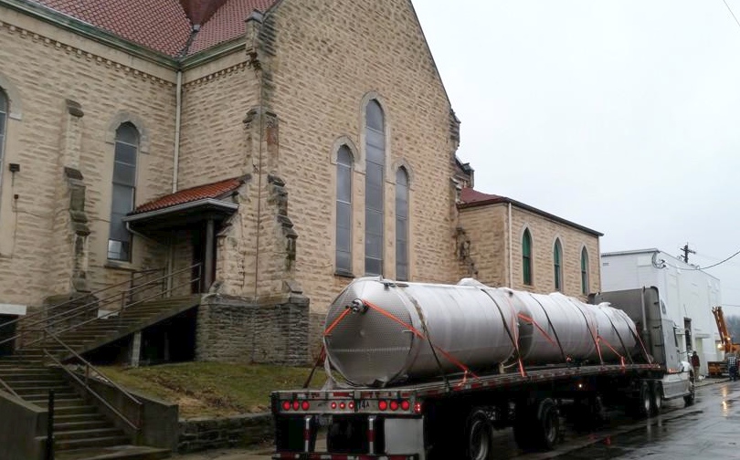 Brewing tanks arrive at the former St. Patrick's Church
