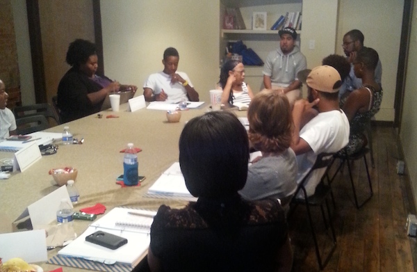 Mike Brown, owner of Brown Lawn Care, takes notes (center) during Mortar's weekly meeting of its new startup class