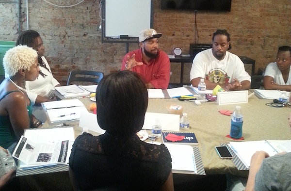 Mortar co-founder Allen Woods (center) speaks with the accelerator's startup class in Over-the-Rhine