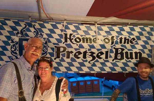 Tom and Anne Harten and a BeckHart staffer work at Newport Oktoberfest last weekend