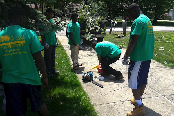 LawnLife youth employees training on site at a job