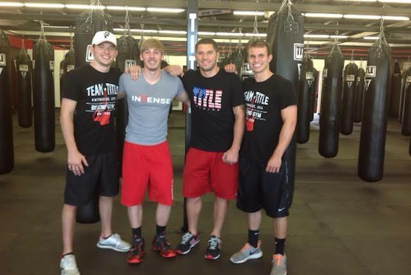 Matt Gregory (second from left) and staff at TITLE Boxing Club in Liberty Township