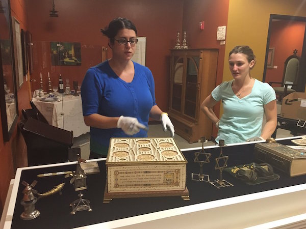 Items at the Center for Holocaust and Humanity Education are inspected.