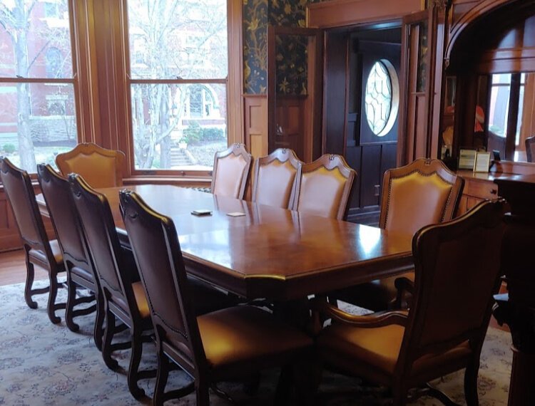 The group met and discussed grantees in the Impact Cowork boardroom.