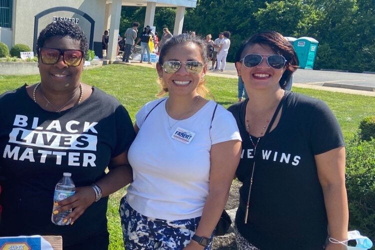 Chris Brown, far left, organized and led the June 7 march. With Shannon Fabert, middle, and Laura Evans.