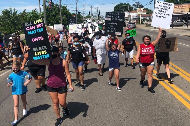 More than 1,200 marched in the June 7 protest.