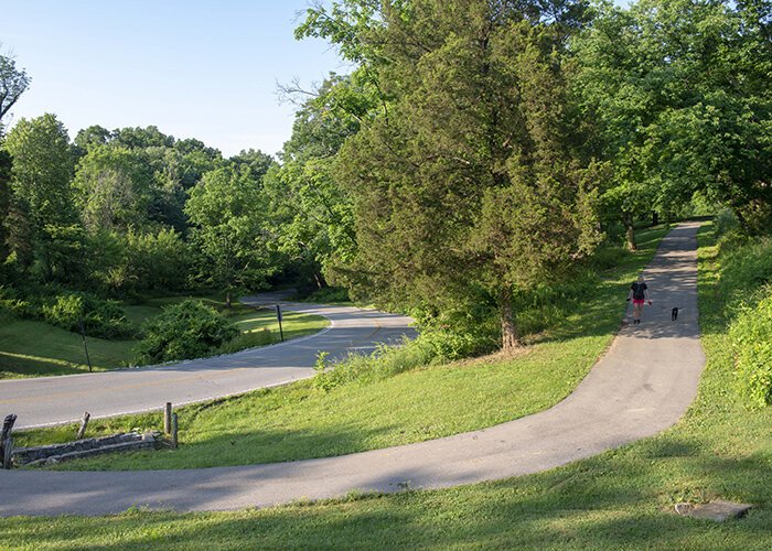 Joggers, dog walkers, hikers, and bicyclists all contribute to Devou's economic impact.